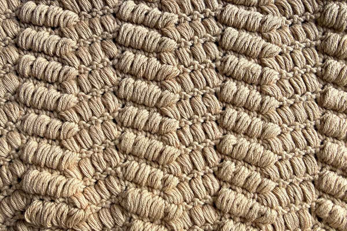 Close up image of the crochet puff path stitch